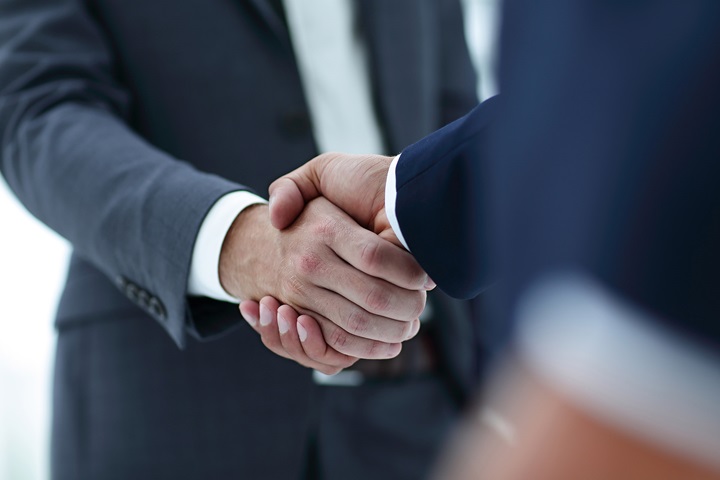 Close up of two businessmen shaking hands