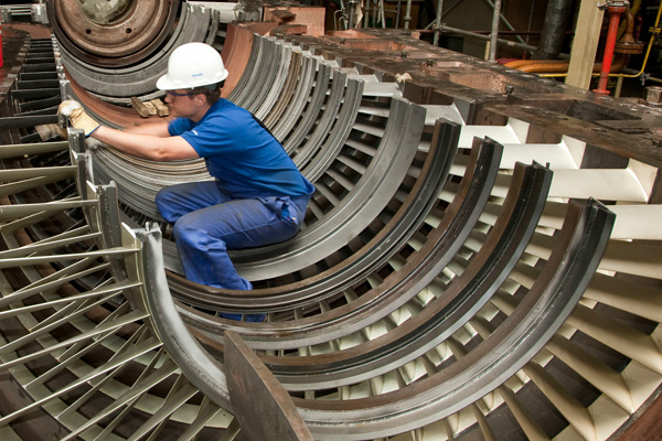 Engineer repairing a turbine
