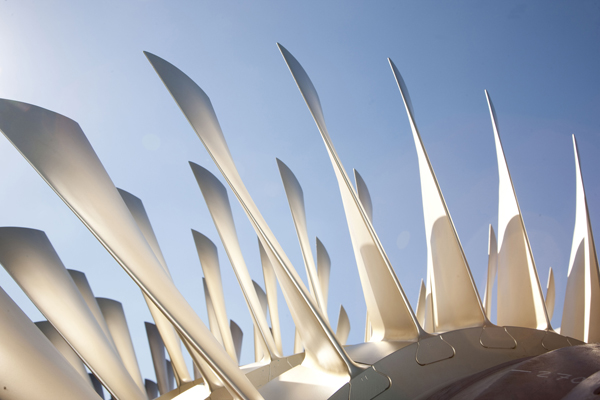Turbine with blue sky and sun shine in the background